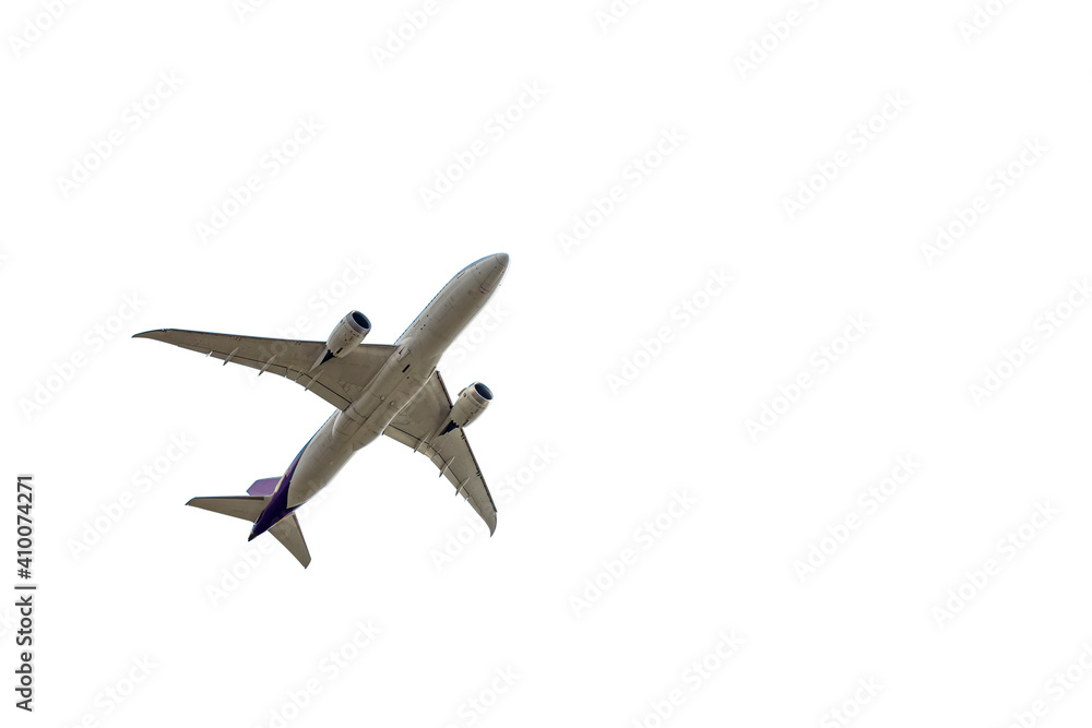 Under view of airplane for commercial passenger or cargo transportation flying isolated on white background with clipping path Under view of airplane for commercial passenger or cargo transportation flying isolated on white background with clipping path