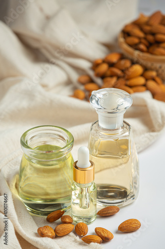 Almond oil in bottle on white background