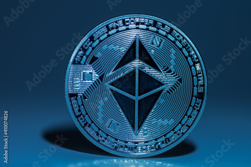 single blue shining ether coin from ethereum with shadow