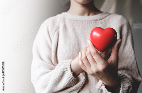 Fototapeta Naklejka Na Ścianę i Meble -  Red hearts with loving and caring adults. Symbol of support that expresses love valentine day and world heart day, heart health concept
