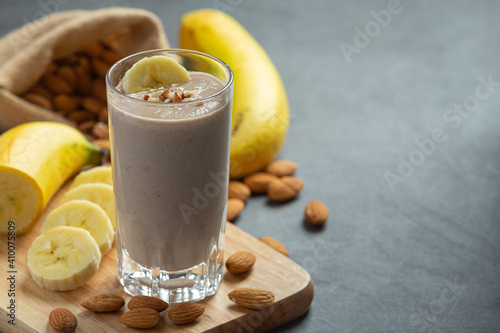 Banana almond smoothie on dark background