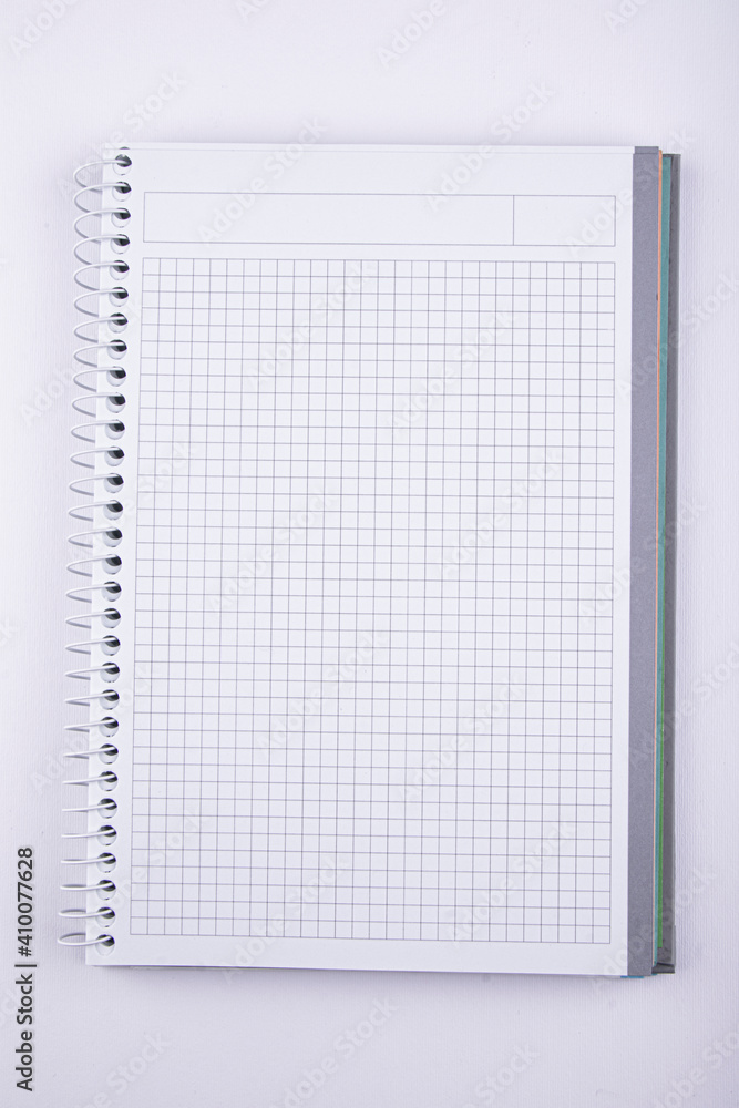 Checkered notebook on a white background Checkered notebook on a white background