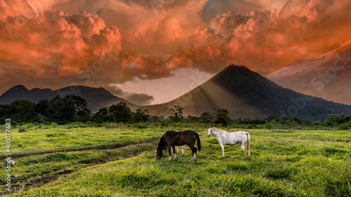 Volcan Arenal dominates the landscape during sunset, as seen from the Monteverde area, Costa Rica. photo