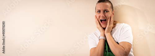 Portrait of woman with shocked facial expression isolated on light background © petrrgoskov