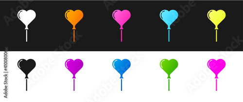 Set Balloons in form of heart with ribbon icon isolated on black and white background. Vector.