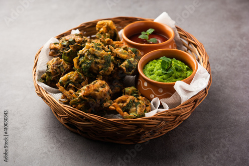 Spinach Firtters or Palak pakoda or pakora. Popular Indian tea-time snack photo