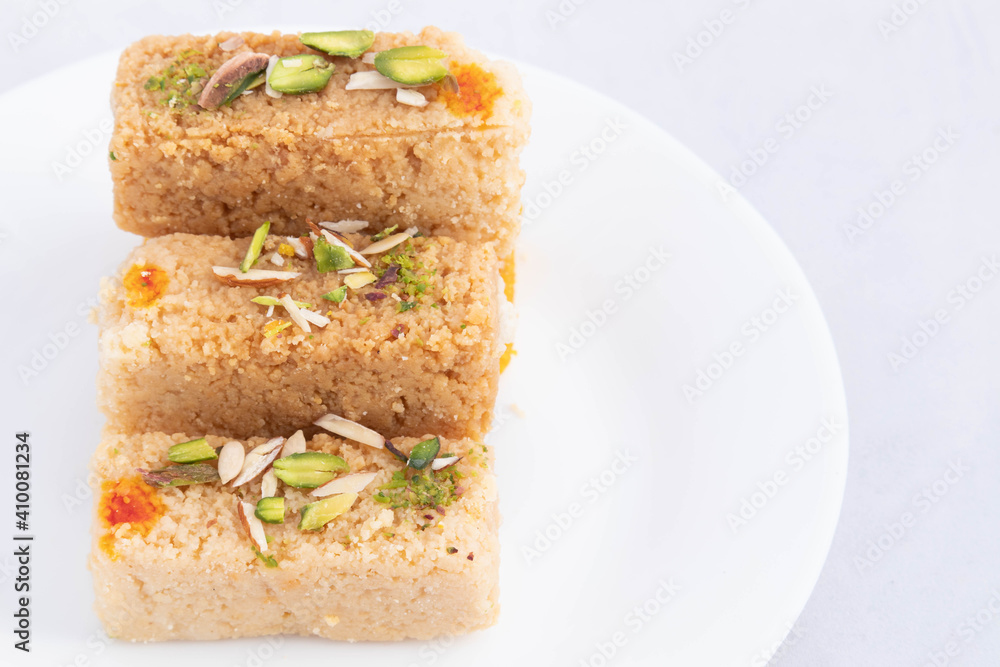 Milkcake Kalakand Burfi Or Alwar Ka Mawa Barfi Made Of Khoya Curdled Doodh Malai And Enjoyed Mostly In Rajasthani Bengali Punjabi Gujrati Culture In India. White Background With Space For Text