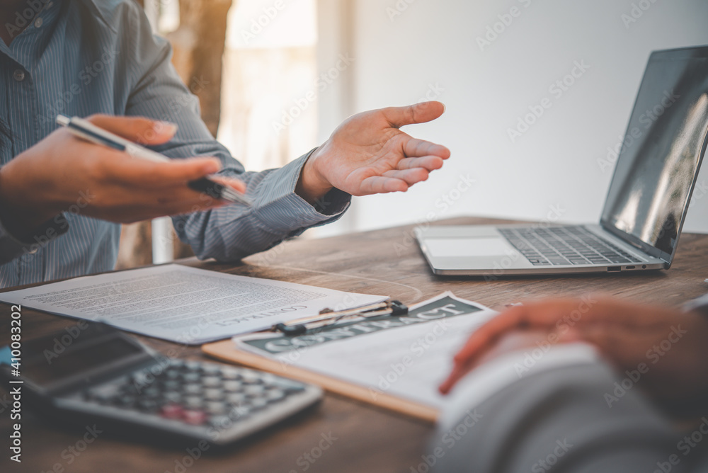 businessman is negotiating, advising, and explaining the matter of the contract to be agreed to sign the contract. businessman is negotiating, advising, and explaining the matter of the contract to be agreed to sign the contract.