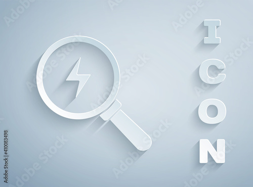 Paper cut Magnifying glass with lightning bolt icon isolated on grey background. Flash sign. Charge flash. Thunder bolt. Lighting strike. Paper art style. Vector.
