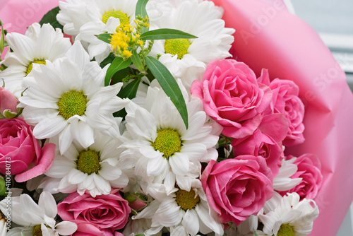 Bouquet of pink roses and white chrysanthemums. Flower background