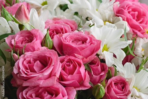 Bouquet of pink roses and white chrysanthemums. Flower background. Selective focus