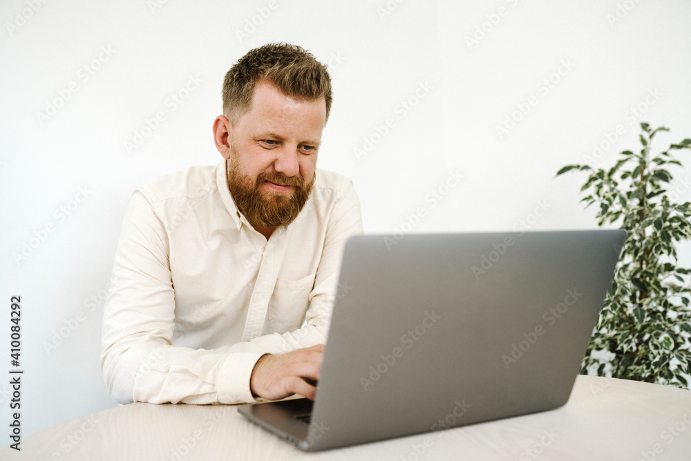 Man using laptop in office Man using laptop in office