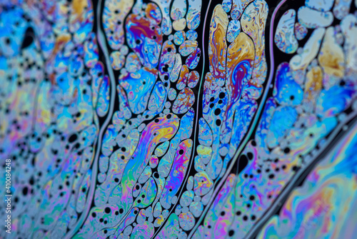 Abstract colorful background in the dominant blue color. Capillary structure with bright shapes. Close up of soap bubbles. © Robert Adami