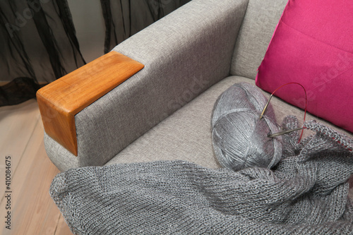 Hand knitting lying on an armchair. © AP-STUDIO
