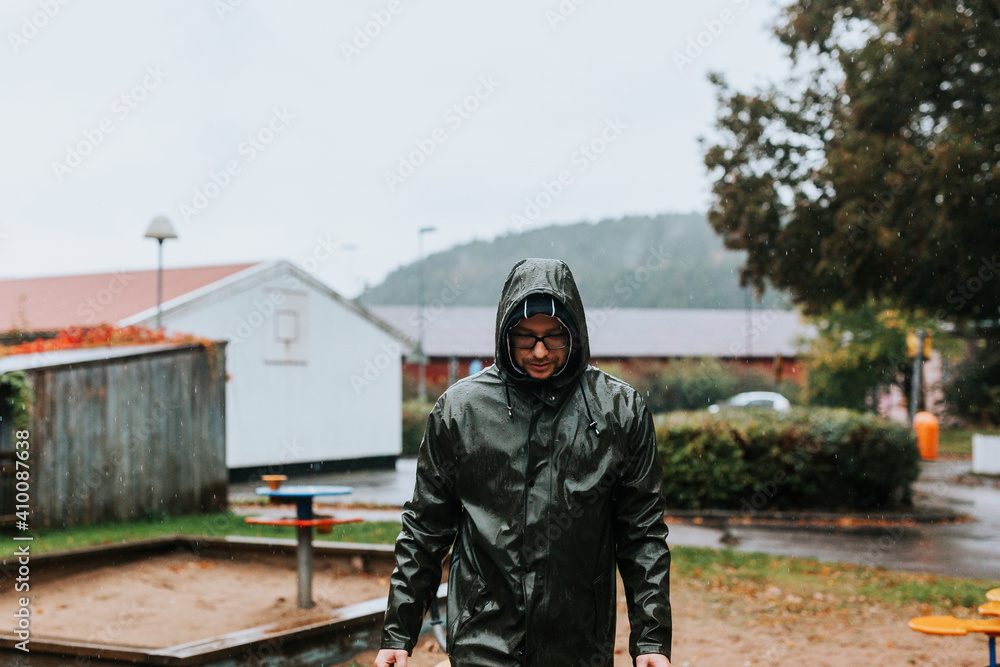 Man walking in rainy weather Man walking in rainy weather