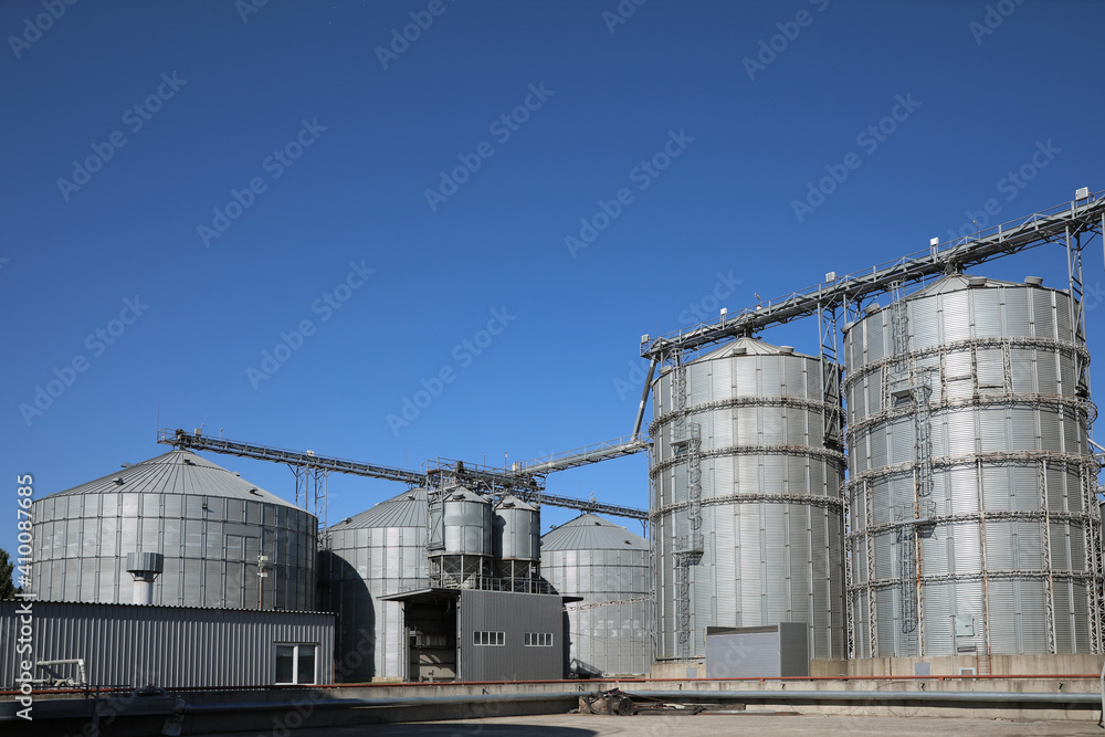 View of modern granaries for storing cereal grains outdoors View of modern granaries for storing cereal grains outdoors