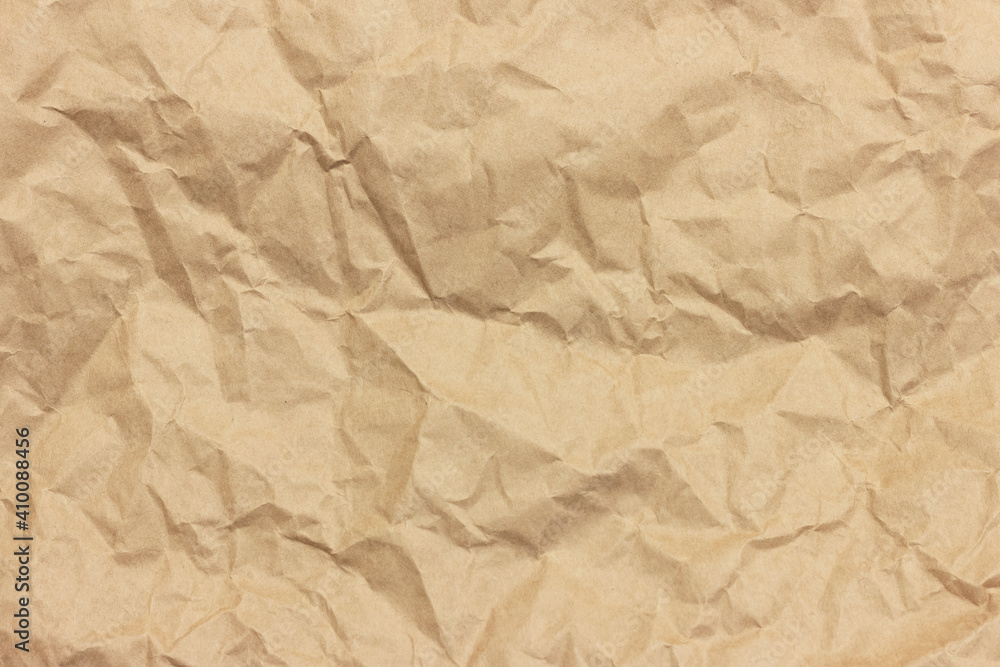 Fototapeta premium The texture of crumpled brown craft paper.