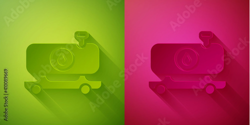 Paper cut Fuel tanker truck icon isolated on green and pink background. Gasoline tanker. Paper art style. Vector. © Kostiantyn