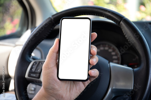 male hand holding phone with isolated screen in car