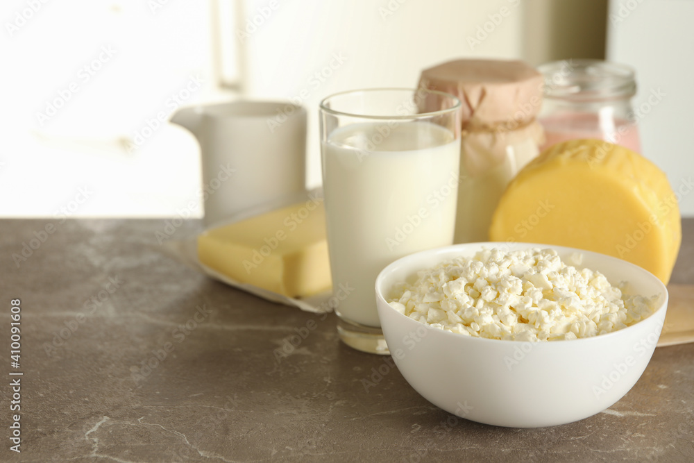 Different fresh dairy products on gray table, space for text Different fresh dairy products on gray table, space for text