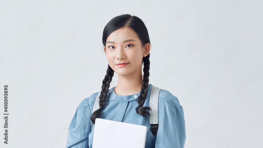 Young smiling student in eyeglasses standing with paper folders isolated over white background Young smiling student in eyeglasses standing with paper folders isolated over white background