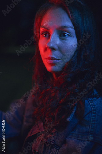 Portrait of a beautiful woman in neon light