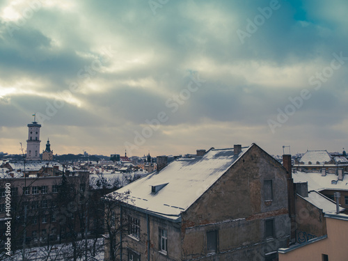 Lviv City in the evening. Central part of the old town of Lvov, cultural tourism center of Ukraine, Europe. Winter travelling. Ancient downtown architecture. Old historic buildings. © KawaiiS