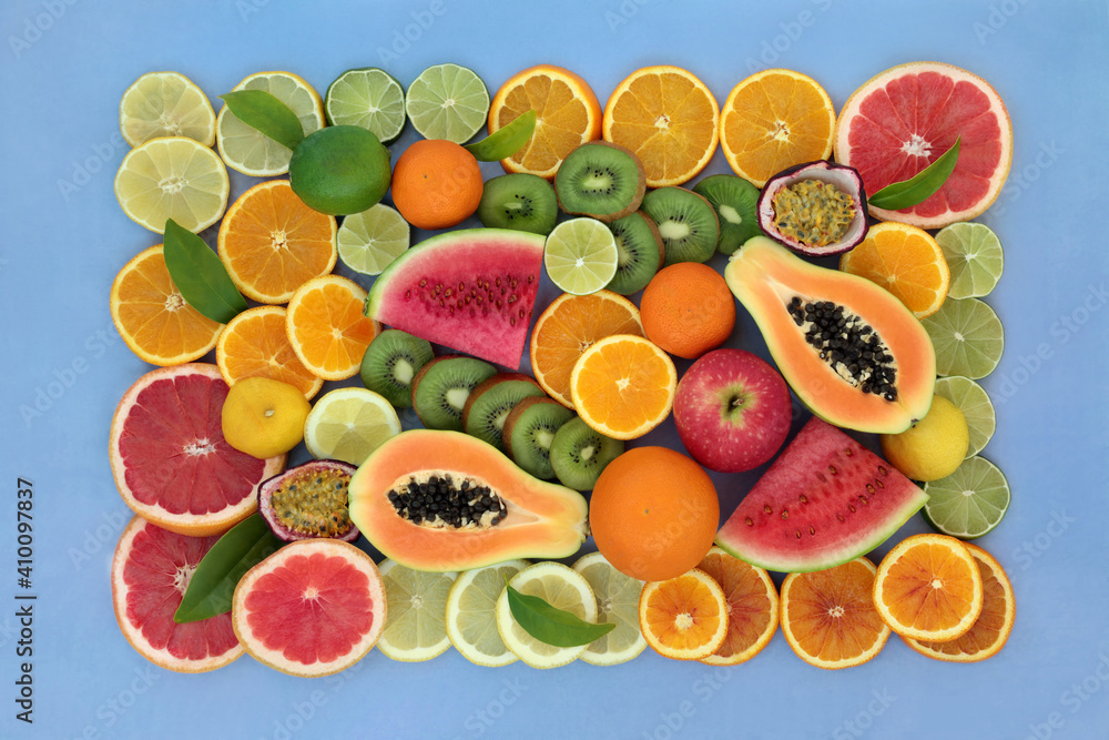 Large collection of high fibre fruit very high in antioxidants, anthocyanins, lycopene & vitamin c. Immune boosting health care concept. Flat lay top view with border on mottled blue background. Large collection of high fibre fruit very high in antioxidants, anthocyanins, lycopene & vitamin c. Immune boosting health care concept. Flat lay top view with border on mottled blue background.