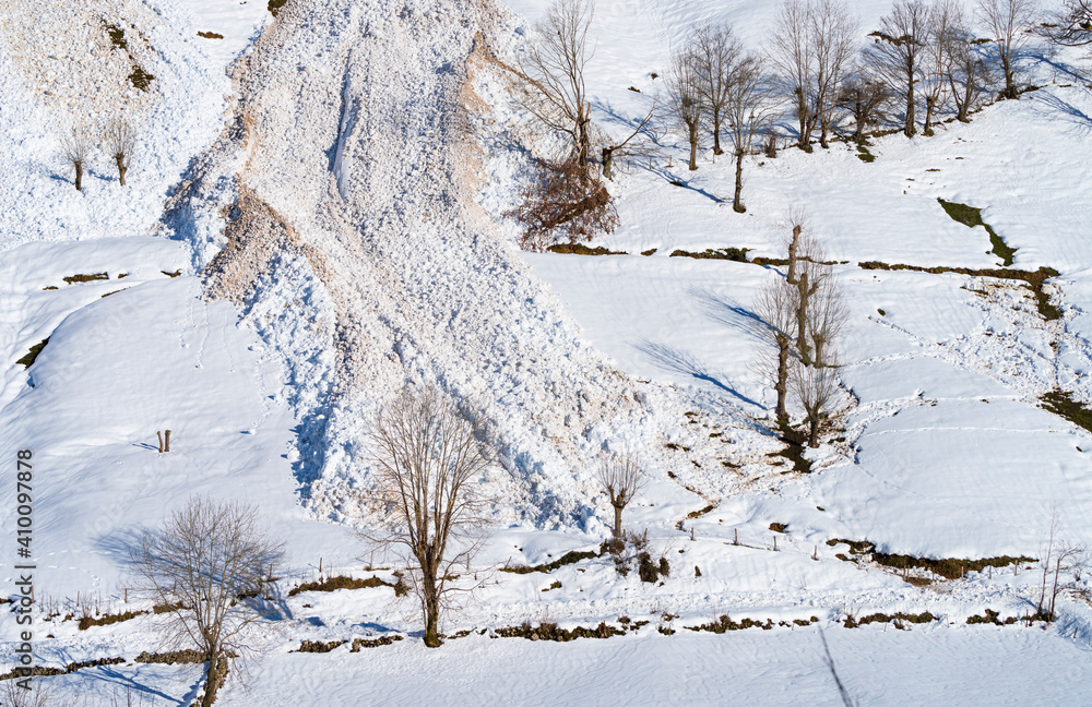 Avalanche in winter in the Valle del Miera in the Valles Pasiegos de Cantabria. Spain.Europe Avalanche in winter in the Valle del Miera in the Valles Pasiegos de Cantabria. Spain.Europe