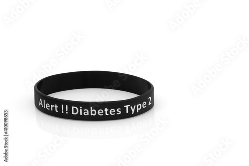 Diabetes type 2 medical alert wristband in black rubber silicone on white background.  photo