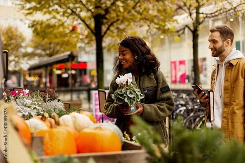 Young couple buying flowers photo