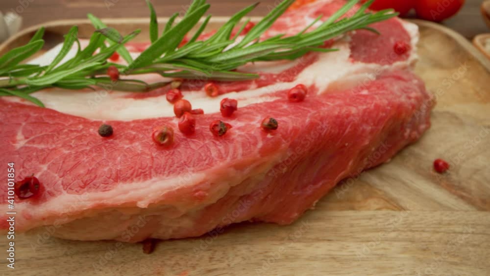Raw beef fillet meat on wooden board close up Raw beef fillet meat on wooden board close up