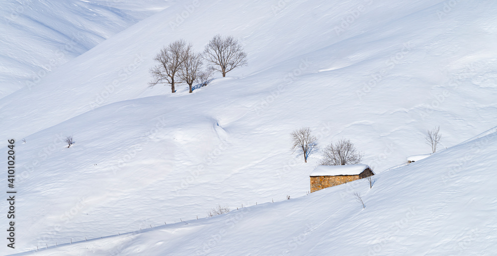 Snowy landscape in winter in the Valle del Miera in the Valles Pasiegos de Cantabria. Spain.Europe