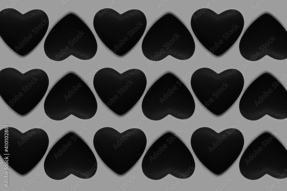Black and white pattern of hearts on grey background. Black and white pattern of hearts on grey background.
