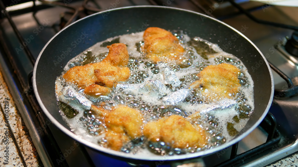 Chicken cutlets frying in a pan Chicken cutlets frying in a pan