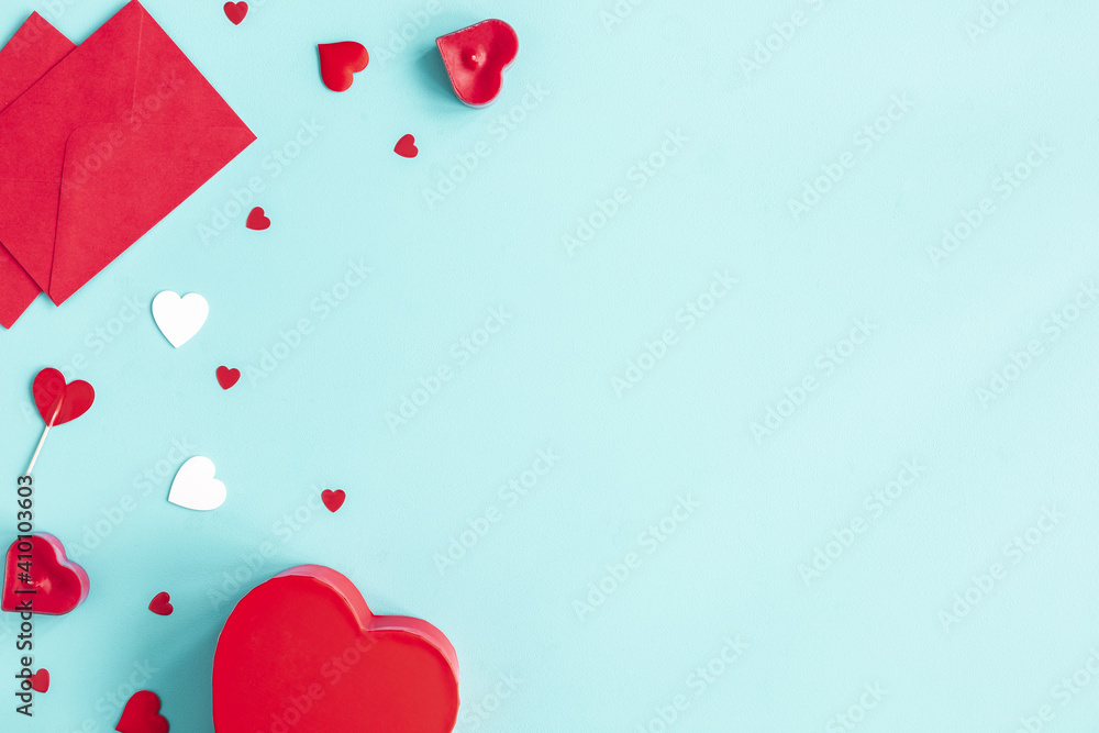 Valentine's Day background. Gift, envelope, hearts on blue background. Valentines day concept. Flat lay, top view