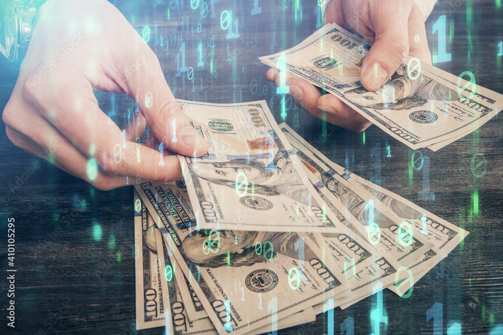 Double exposure of technology drawing hologram and us dollars bills and man hands. Data concept Double exposure of technology drawing hologram and us dollars bills and man hands. Data concept