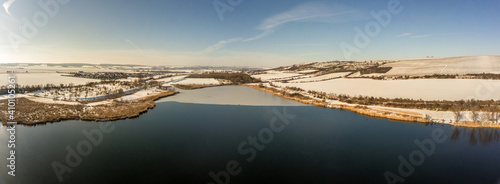 Teil des Süßen See mit Blick auf Lüttchendorf und Wormsleben im Winter mit Eisdecke auf dem See photo