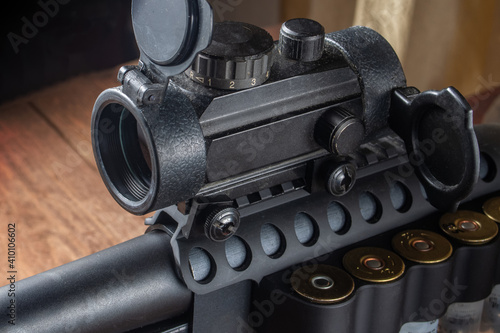 red dot collimator sight on 12 gauge rifle