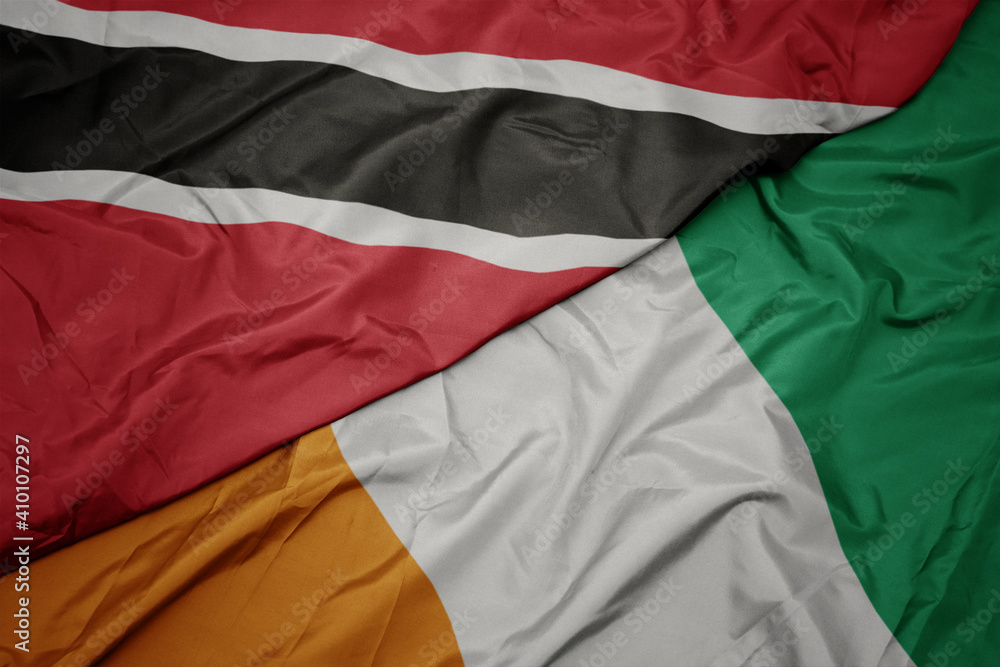 waving colorful flag of cote divoire and national flag of trinidad and tobago.