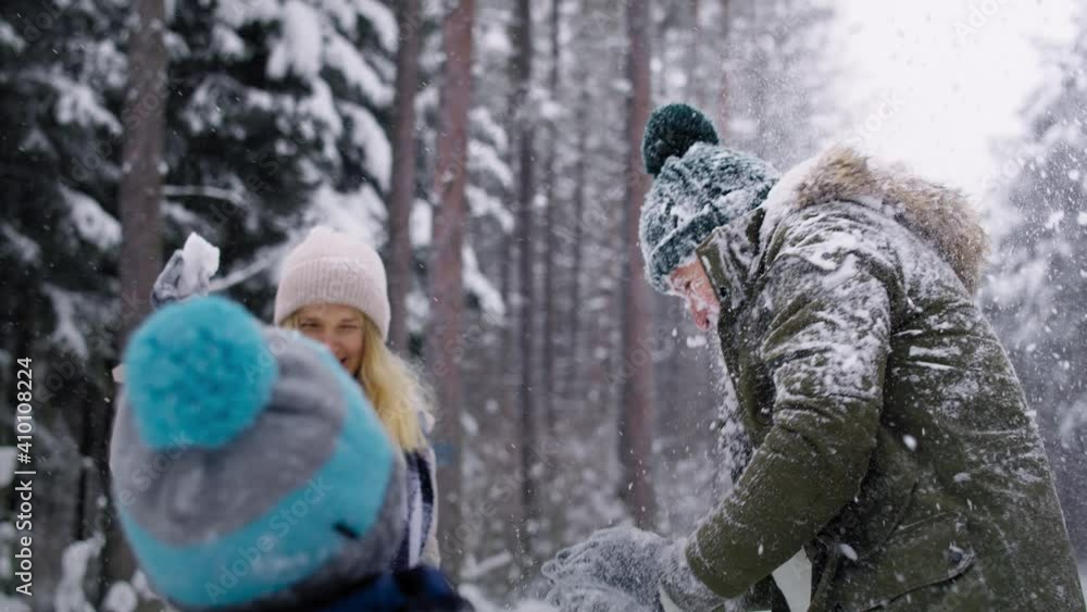 Video of family having a snowball fight in the snow. Shot with RED helium camera in 8K. Video of family having a snowball fight in the snow. Shot with RED helium camera in 8K.