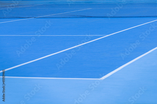 detail of a tennis court in blue with white lines