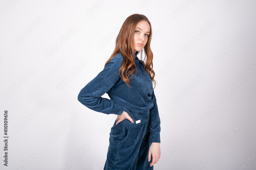 Young girl in a blue suit, on an isolated background Young girl in a blue suit, on an isolated background