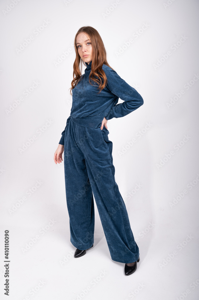 Young girl in a blue suit, on an isolated background Young girl in a blue suit, on an isolated background