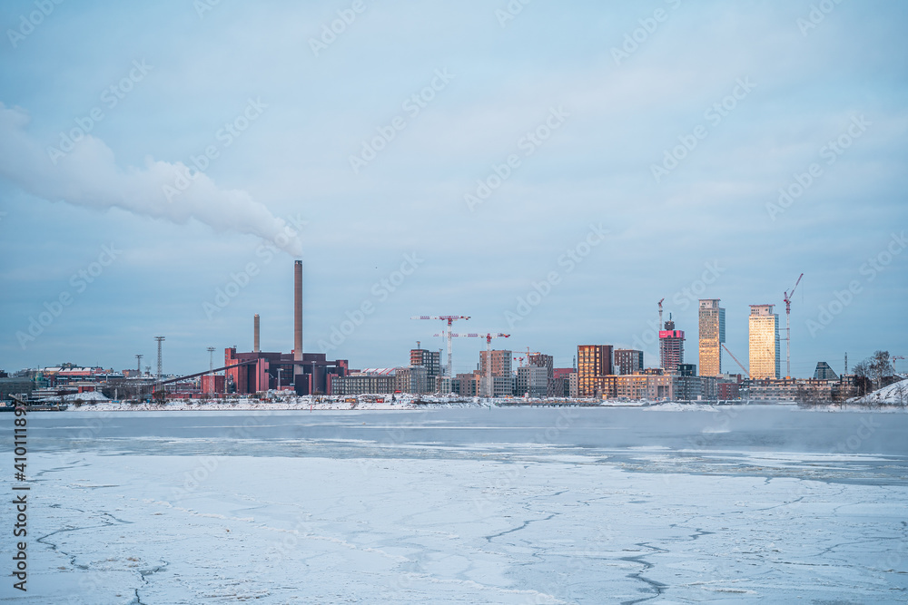 City skyline in Helsinki during winter with frozen sea
