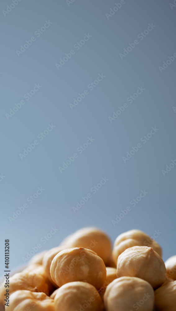 a handful of hazelnuts on a gray background close-up a handful of hazelnuts on a gray background close-up