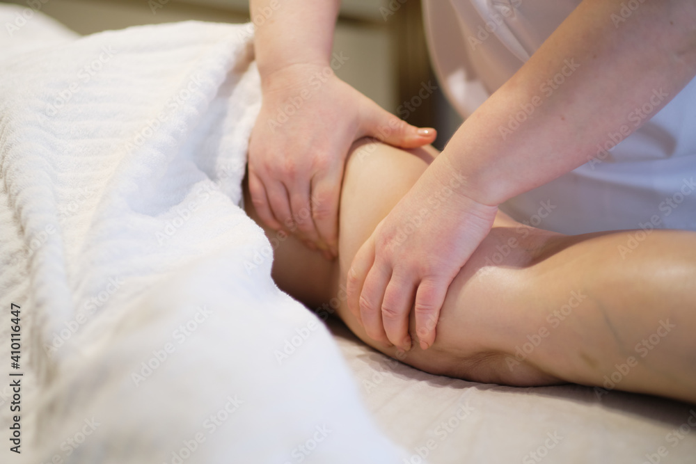 Body care concept. Special anticellulite treatment. Masseur makes anticellulite massage young woman in spa salon. Close up view Body care concept. Special anticellulite treatment. Masseur makes anticellulite massage young woman in spa salon. Close up view