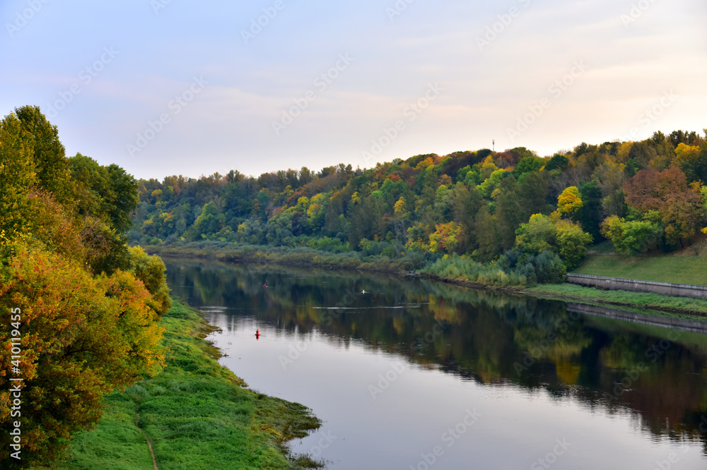 View of the Western Dvina (Zapadnaya Dvina) river in the center of the city of Vitebsk in the Republic of Belarus. Autumn landscape