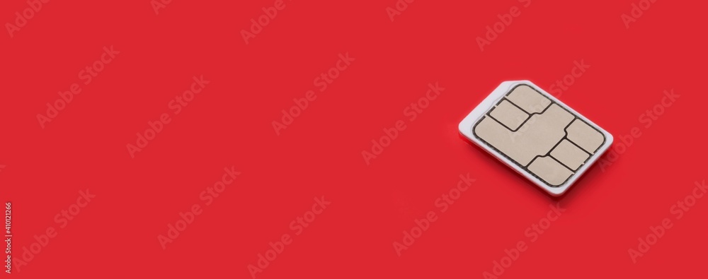 Фотография SIM Card - Isolated on red background