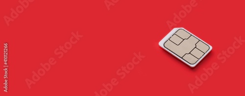 Принти на полотні SIM Card - Isolated on red background